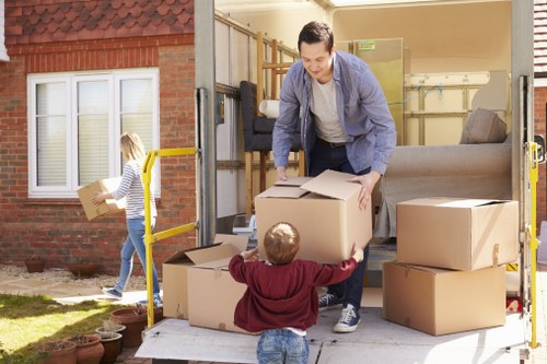 Man and van service loading household items into a van