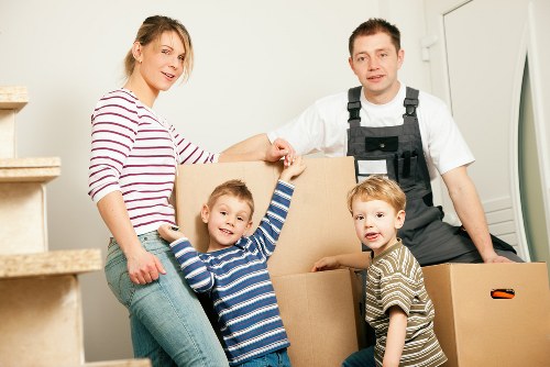 Furniture being carried carefully from a Finchley property