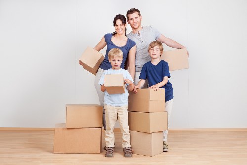 Removal team planning a house move in Finchley residential street