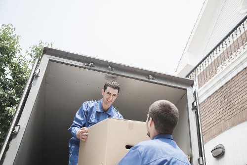 Loading household items into a van for a Finchley move