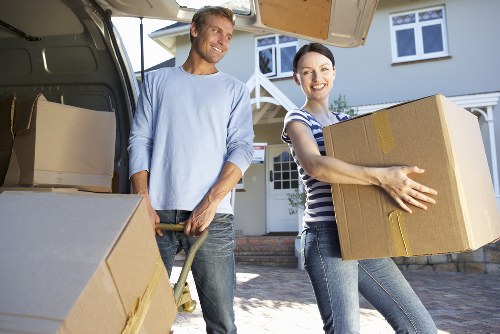Household furniture and moving boxes ready for Finchley removal service