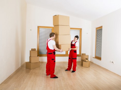 Professional van loading with safety measures in place